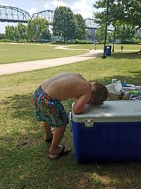 Rear view of boy on field
