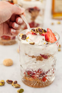 Close-up of hand holding ice cream