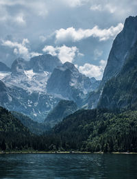 Scenic view of lake and mountains against sky