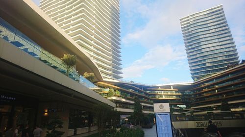 Low angle view of buildings in city against sky