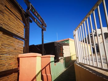 Low angle view of building against clear blue sky