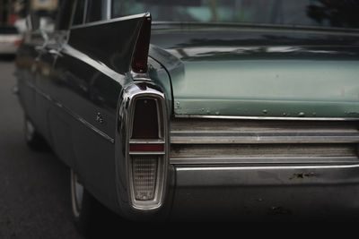 Close-up of car on street