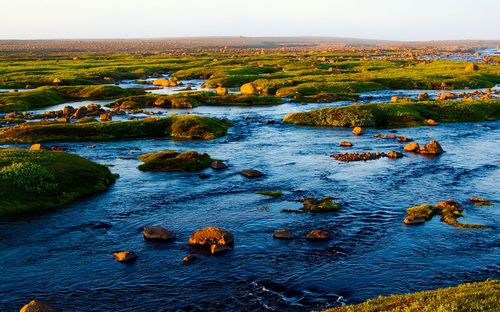 Scenic view of river against sky