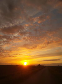 Scenic view of landscape against sky during sunset