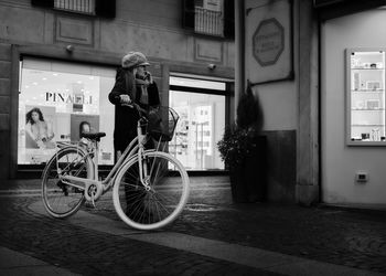 Bicycles on footpath by building