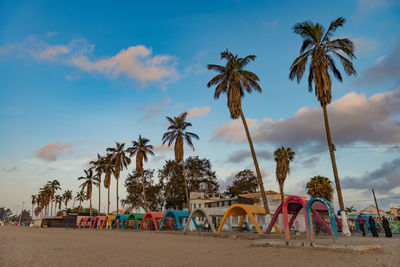 People on beach against sky