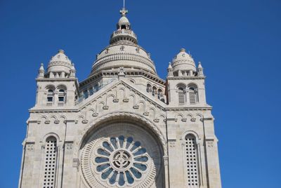 Low angle view of a building against blue sky