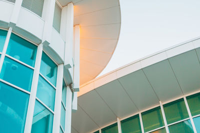 Low angle view of modern building against clear blue sky