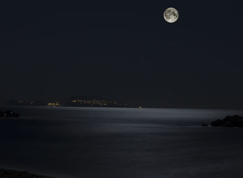 Scenic view of sea against sky at night