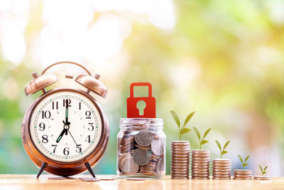 Close-up of clock on table