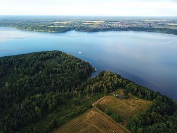 High angle view of trees and sea against sky