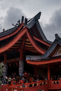 View of temple building against cloudy sky