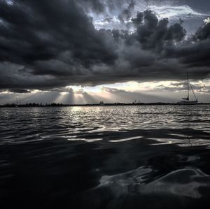 Scenic view of sea against dramatic sky