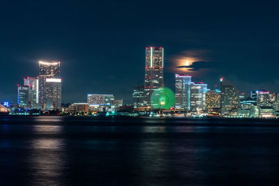 Illuminated buildings in city at night