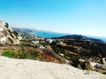 Scenic view of mountain range against blue sky