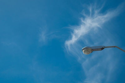 Low angle view of street light against sky