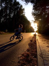 People riding bicycle on road