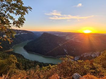 Scenic view of mountains against sky during sunset