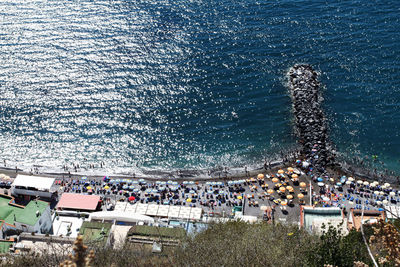 High angle view of crowd at sea shore