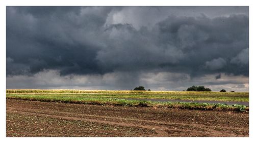 Storm clouds over farm