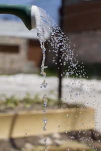 Close-up of water drops falling from fountain