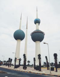 View of communications tower against cloudy sky