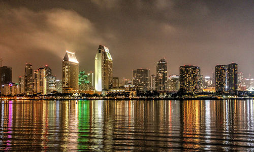 Illuminated city at waterfront