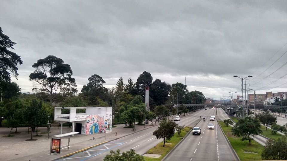 transportation, tree, road, land vehicle, car, mode of transport, street, sky, cloud, high angle view, city, travel, city life, travel destinations, cloud - sky, day, vehicle, outdoors, the way forward, cloudy, diminishing perspective, storm cloud, journey