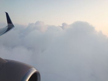 Cropped image of airplane flying in sky