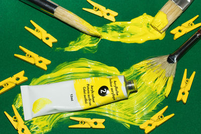 High angle view of yellow toys on table