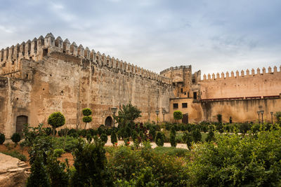 Historic building against cloudy sky