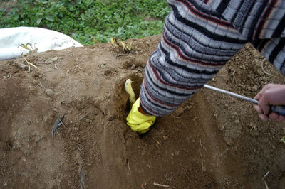 High angle view of man working in mud