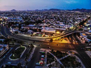 High angle view of illuminated cityscape at night