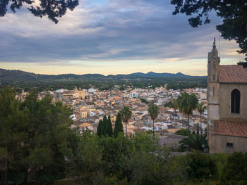 Buildings in town against sky