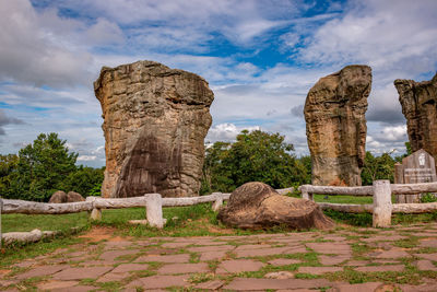 Ruins of rocks against cloudy sky