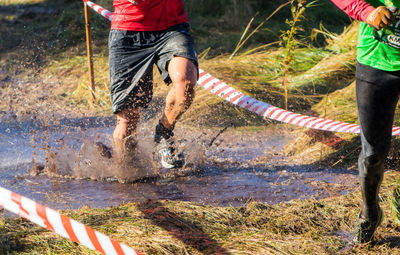 Low section of people running on river