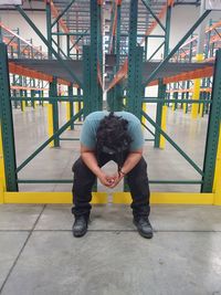 Full length of man standing on railway bridge