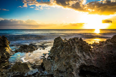 Scenic view of sea against sky during sunset