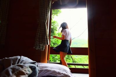 Full length of woman looking at view