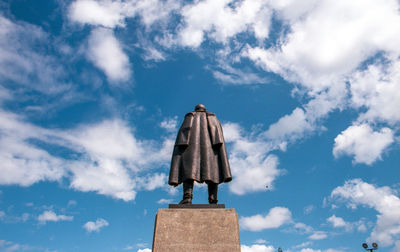 Low angle view of statue against blue sky