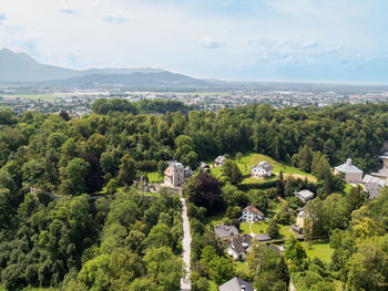 High angle view of trees and buildings against sky