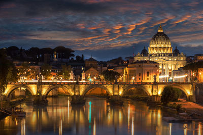 Ponte sant angel over tiber river in city at night