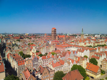 High angle view of townscape against blue sky