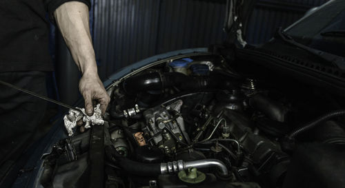 Low section of man washing car