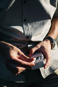 Close-up of man using mobile phone