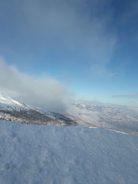 Scenic view of snowcapped mountain against sky