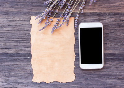 High angle view of smart phone on table