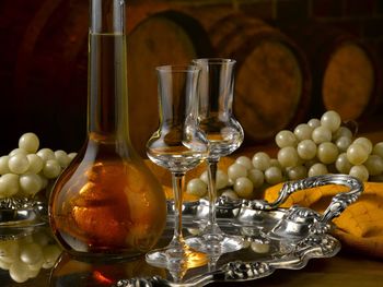 Close-up of wine glasses on table