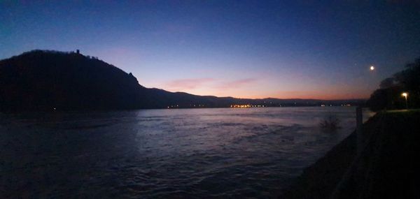 Scenic view of sea against clear sky at night