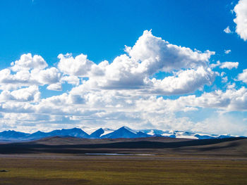 Panoramic view of landscape against cloudy sky